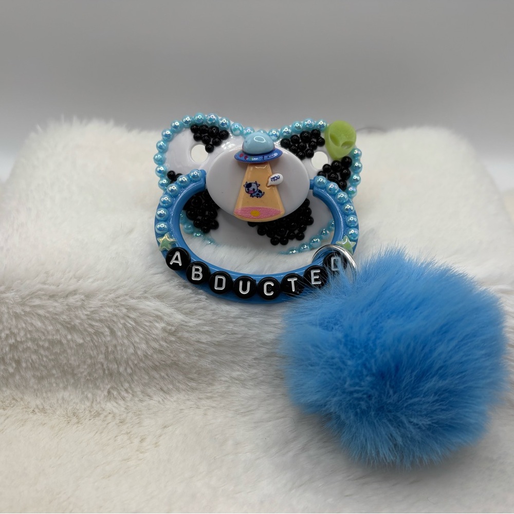 Abducted cow adult pacifier